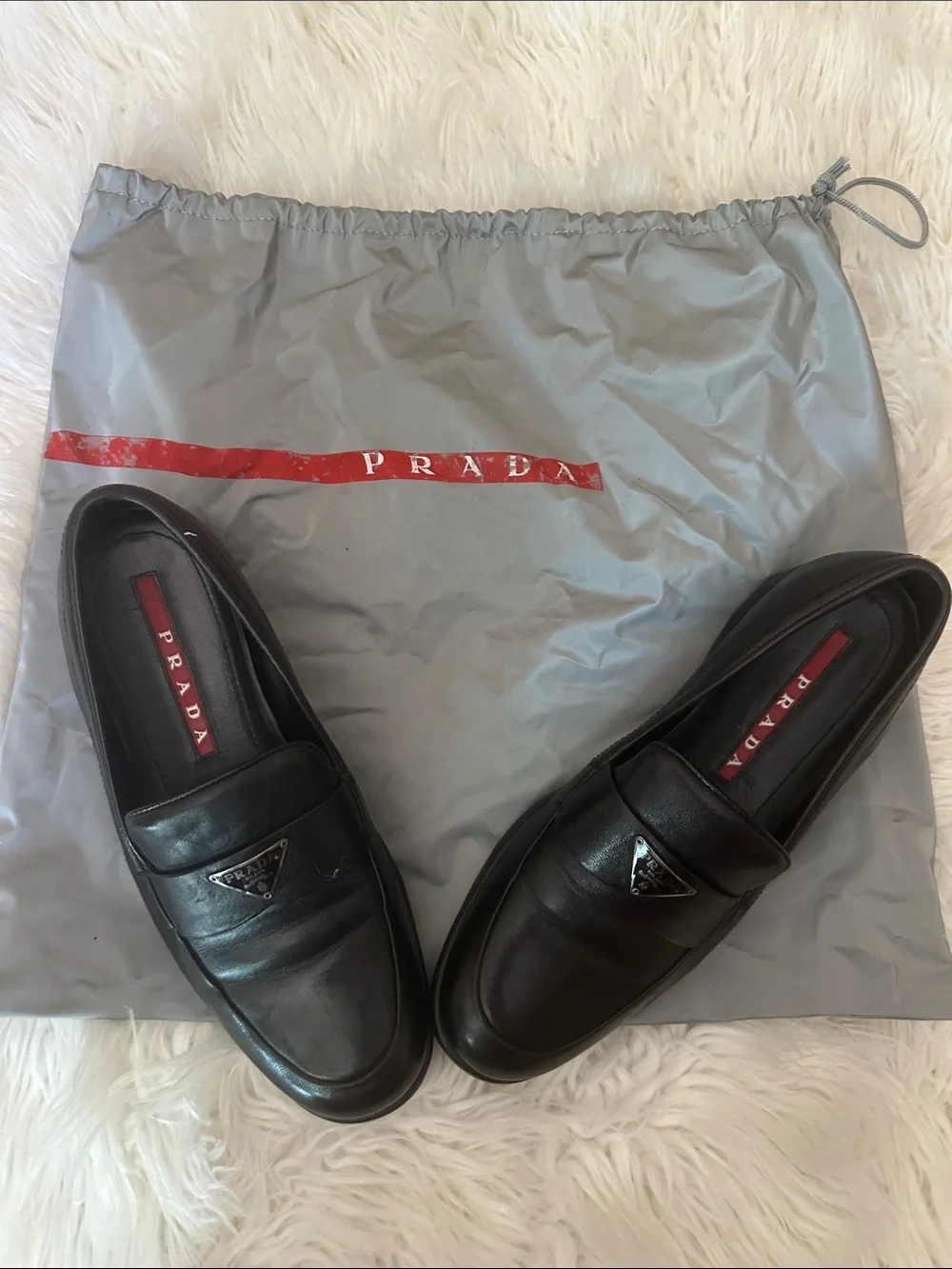 Prada Black Leather Slip-On Loafers with Triangular Logo
